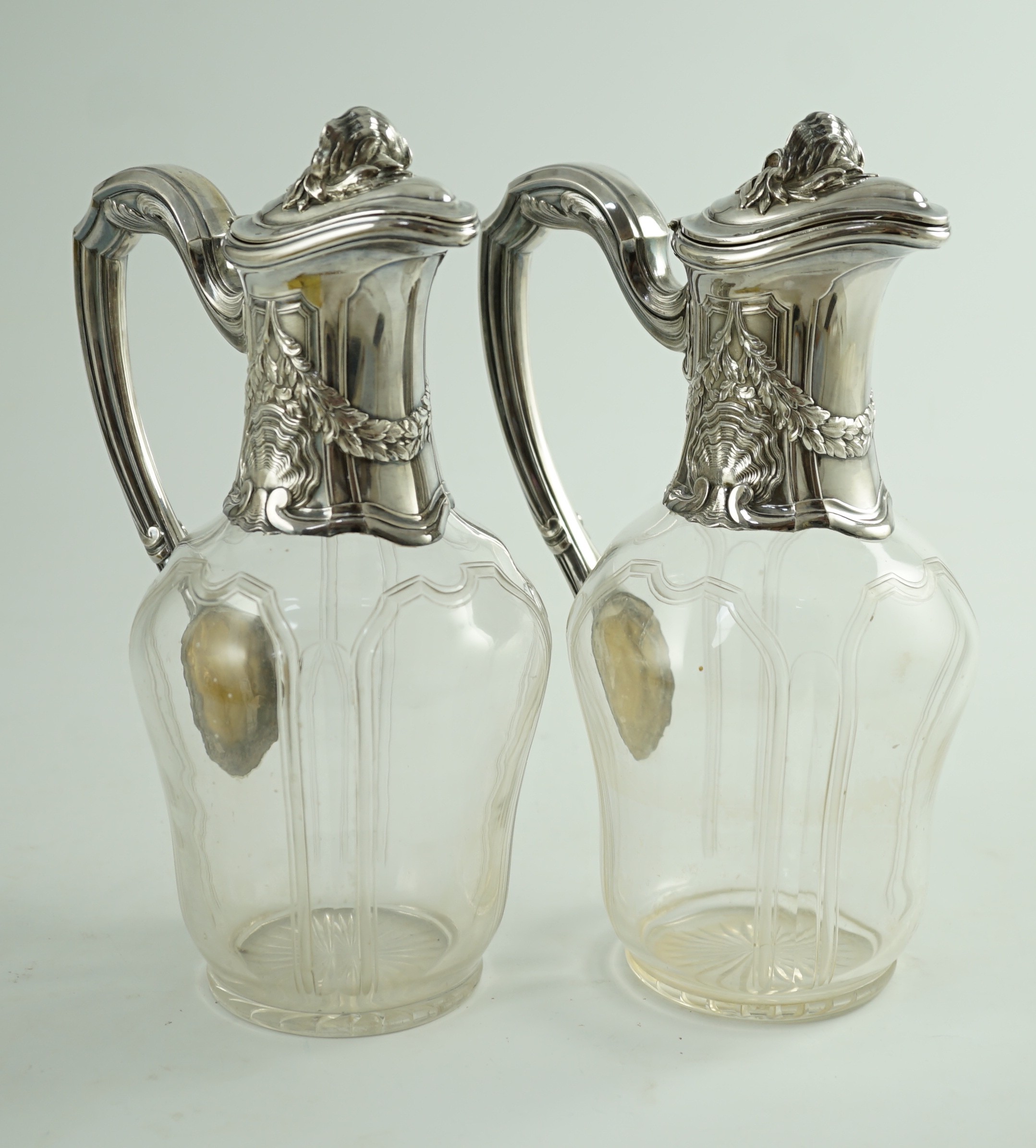 A pair of early 20th century French 950 standard silver mounted glass claret jugs, by Risler & Carre